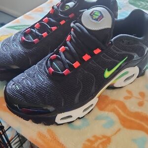 Nike Kids Black Sneakers with Neon Green Swoosh and Coral Pink Lace Accents.